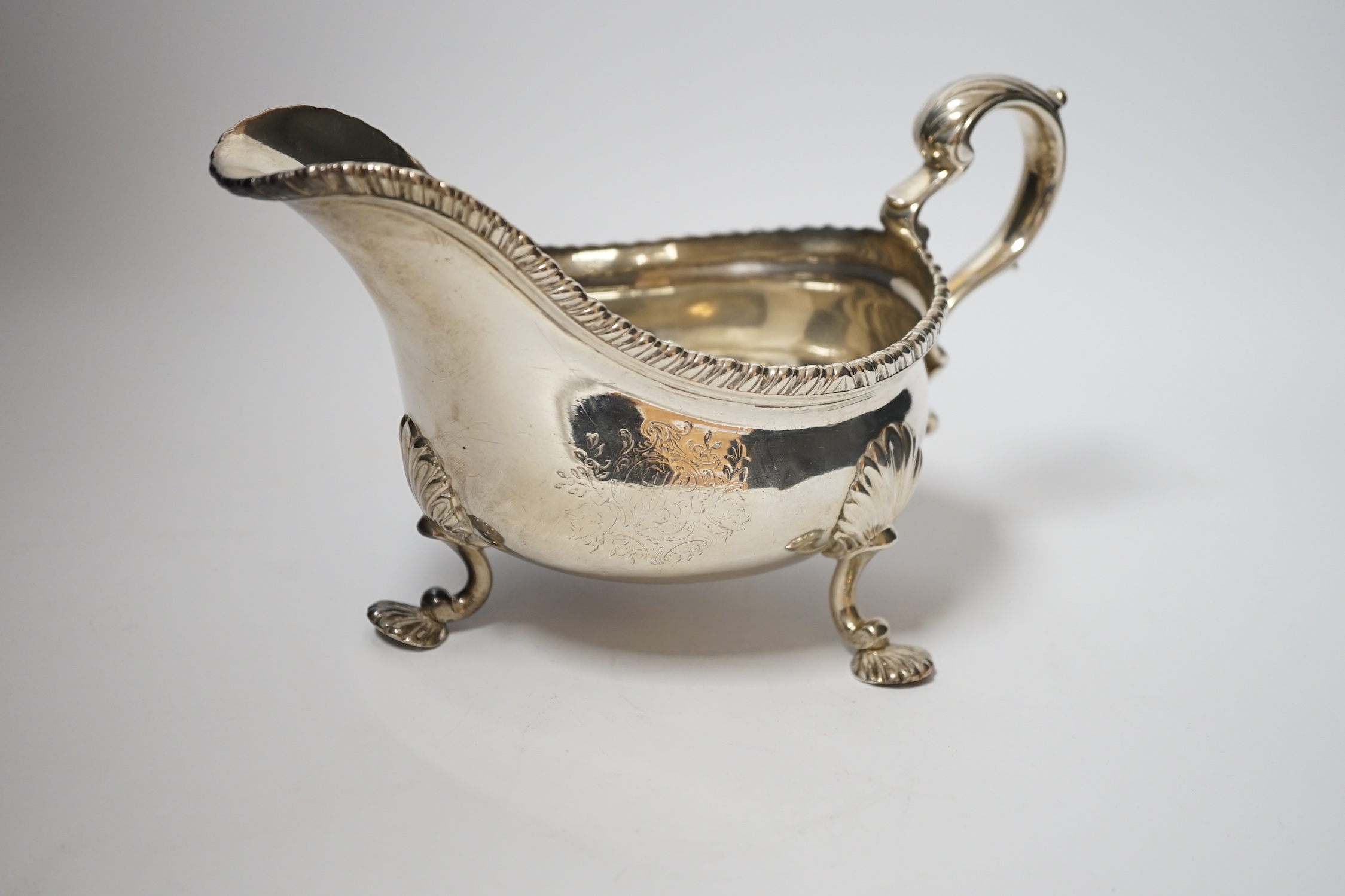 A George III silver sauce boat, maker's mark rubbed, London, 1761, 19.2cm, 12.6oz.